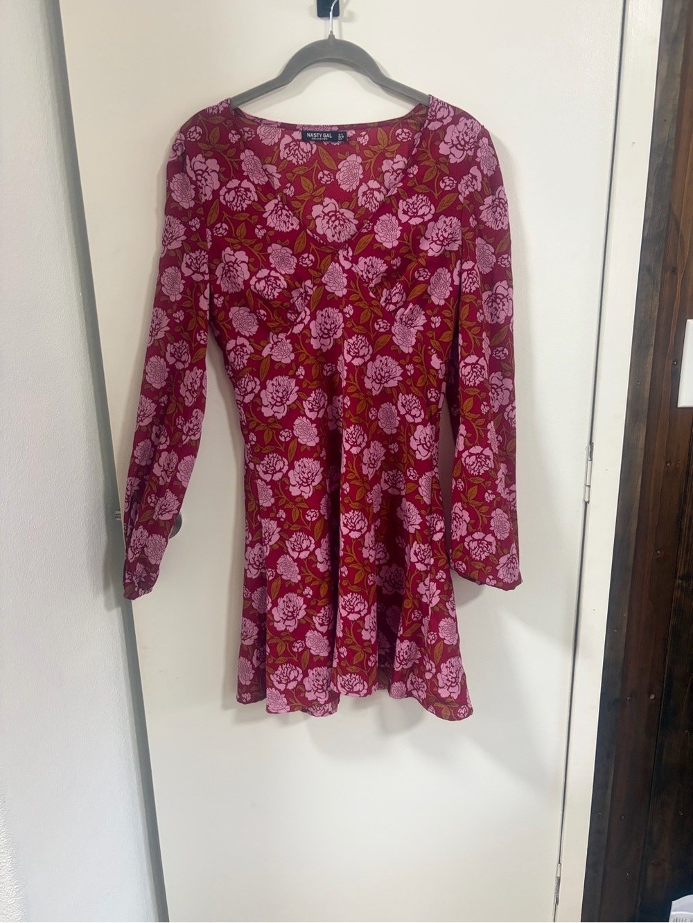 Nasty Gal Pink Floral Long Sleeve Mini Dress on Red Background
